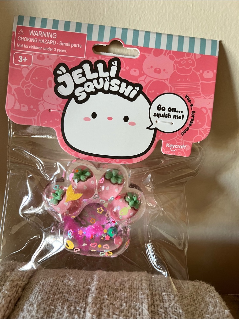 Pink Glitter Paw Squishy with strawberry Charms
